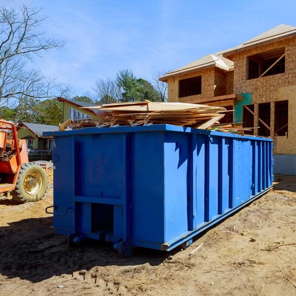 construction dumpsters can hold a variety of materials, including debris from demolition projects, roofing materials, lumber, and concrete